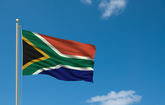 Flag of South Africa waving in the wind in front of blue sky