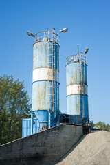 Blue cement silos in the cement factory