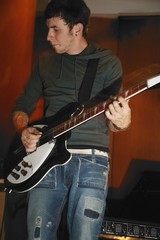 Obraz premium Man Plays His Electric Guitar