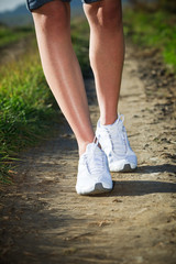 Woman walking cross country and trail