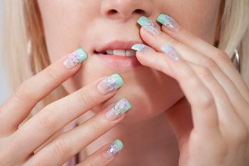 Women with acrylic fingernails