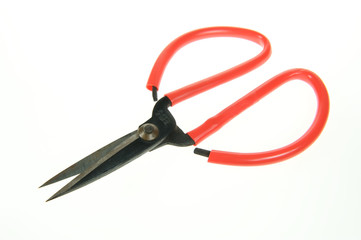 a red scissors on a white background