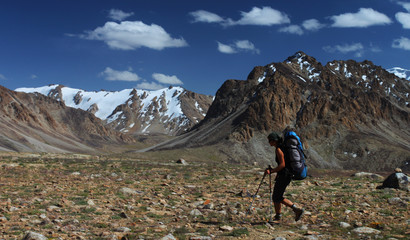Fototapeta premium Hiker with backpack in mountains of Central Asia