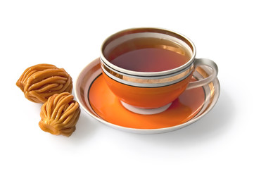 Tea in an orange cup with nath
