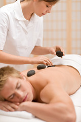 Obraz na płótnie Canvas Lastone therapy - man at luxury massage