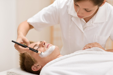 Male cosmetics - facial mask in salon