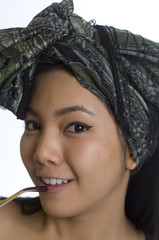 Portrait of young Asian woman with headscarf