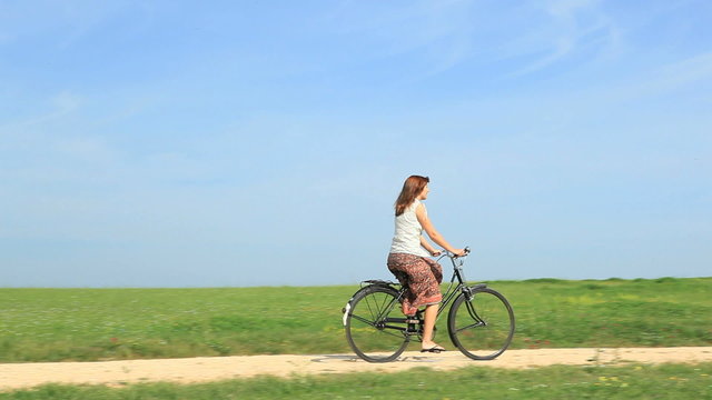 Woman at outdoor riding a bycicle
