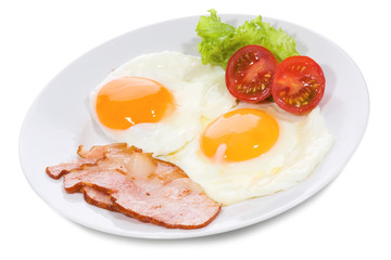 fried eggs with  bacon and vegetables