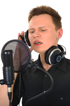 young man with microphone on white background