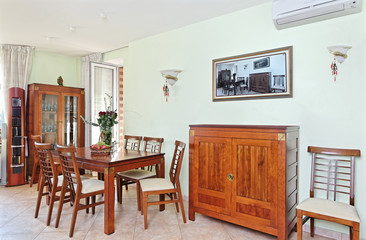 Dining room interior with classic wooden furniture