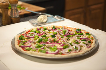 Uncooked homemade vegetarian pizza