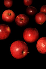 Red apples on a black background