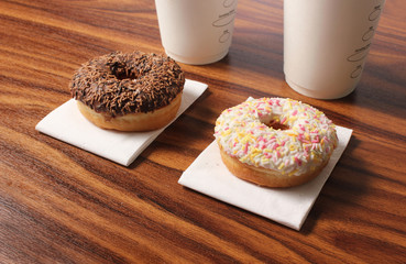two donuts on an office desk