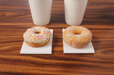 two ring donuts on an office desk