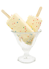 Delicious ice cream in glass bowl isolated over white