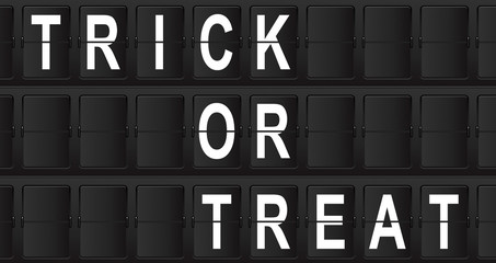 Panel de aeropuerto con texto TRICK OR TREAT