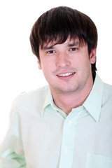Portrait of a happy young man standing against white background