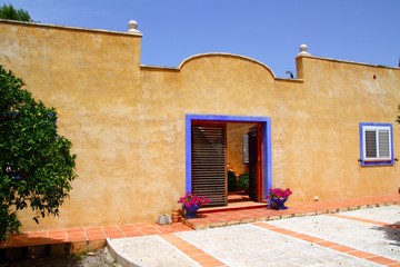 Beautiful house facade yellow blue mediterranean style