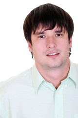 Portrait of a happy young man standing against white background