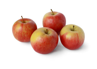 Four ripe juicy red apple on a white background