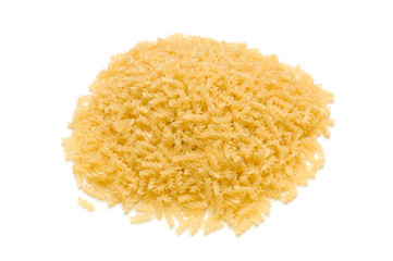 heap of raw pasta on the white background