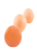 Three brown eggs