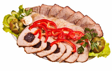 Dish with sliced meat stuffed with plums, pate, ham.