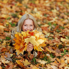 Naklejka na ściany i meble woman portret in autumn leaf