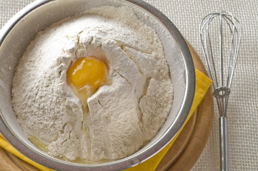 White flour and egg  in bowl
