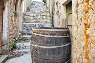 Cedar barrel in a narrow street