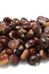 Isolated macro image of raw chestnuts