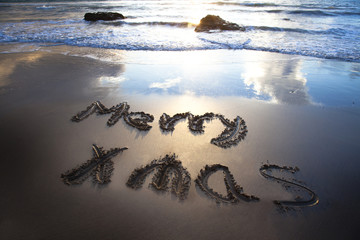 merry christmas on the bech with sunrise