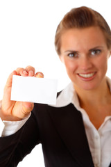smiling modern business woman holding blank business card