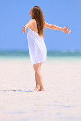 Young woman dancing at beach