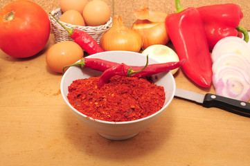 Ground chili peppers and raw vegetables