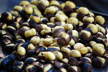 Chestnuts roasting in a hot pan.