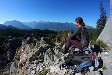 Young woman enjoying mountain panorama in the Alps