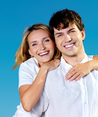 Fototapeta premium beautiful couple on blue sky