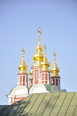 Fototapeta na wymiar BronzeGolden domes of Novodevichiy convent in Moscow
