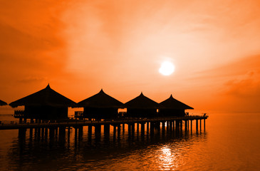 Sunset and water bungalows