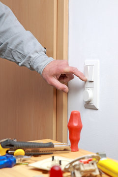 Installing a light switch.
