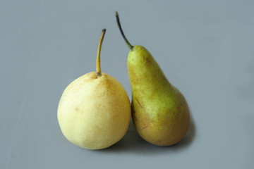 Conference and chinese pears isolated on grey