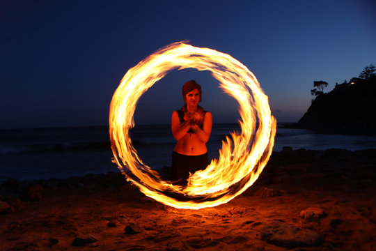 Fire Dance Along The Beach In The Dark