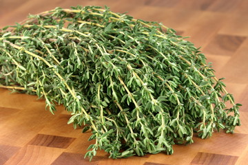 thyme on wood cutting board
