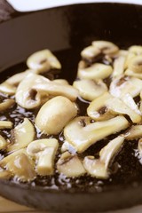 Button mushrooms on a pan