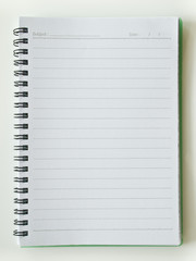 An opened white page spiral notebook