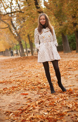 Beautiful young woman at fall