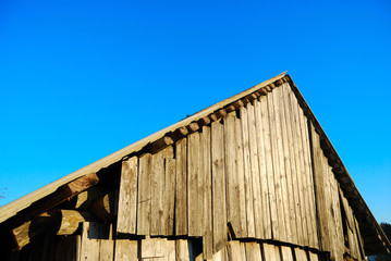 Old roof against the blue sky