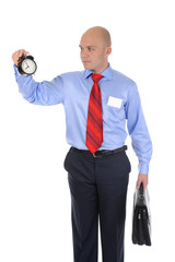 businessman with an alarm clock in a hand.